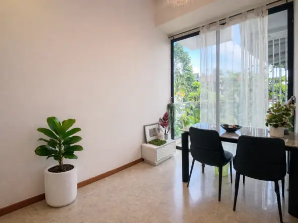 Spacious living room with floor-to-ceiling windows and natural light