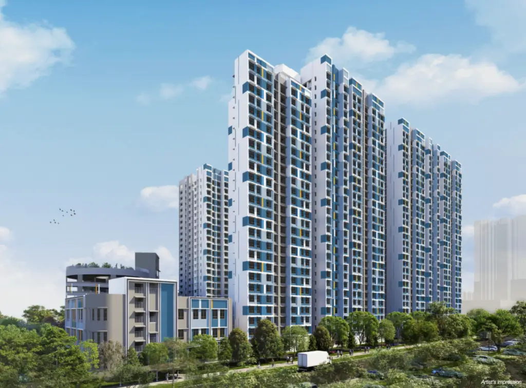 Modern high-rise residential complex with tall white and blue towers against a blue sky, surrounded by greenery and a street.