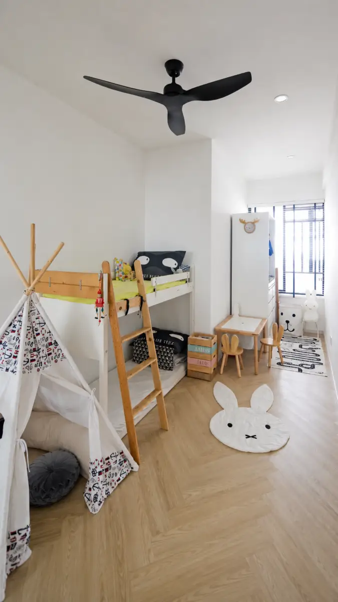 Bright children's playroom with a white bunk bed, wooden ladder, and a teepee tent on the left, plus a large bunny rug on a light wood floor.