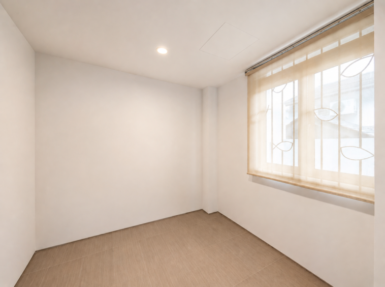 Empty white-walled room with beige tiled floor and a large window covered by sheer blinds letting in soft light